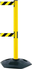 Tensator - 38" High, 2-1/2" Pole Diam, 4 Way Stanchion - 19" Base Diam, Octagon Recycled Rubber Base, Yellow Plastic Post, 7-1/2' x 2" Tape, Dual Line Tape, For Outdoor Use - Industrial Tool & Supply