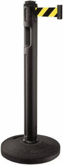 Lavi Industries - 38-1/4" High, 3-1/4" Pole Diam, Stanchion - 16" Base Diam, Dome Recycled Rubber Base, Black Plastic Post, 12' x 2" Tape, Single Line Tape, For Outdoor Use - Industrial Tool & Supply
