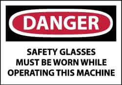 NMC - Accident Prevention Label, Header: DANGER - Legend: Danger - Safety Glasses Must Be Worn While Operating This Machine, English, Red, Black & White, 5" Long x 3" High, Sign Muscle Finish - Industrial Tool & Supply