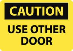 NMC - Caution - Use Other Door, Aluminum Fire and Exit Sign - 14" Wide x 10" High - Industrial Tool & Supply